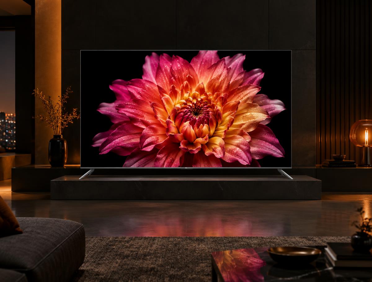 A slim 4K television displaying a vivid flower